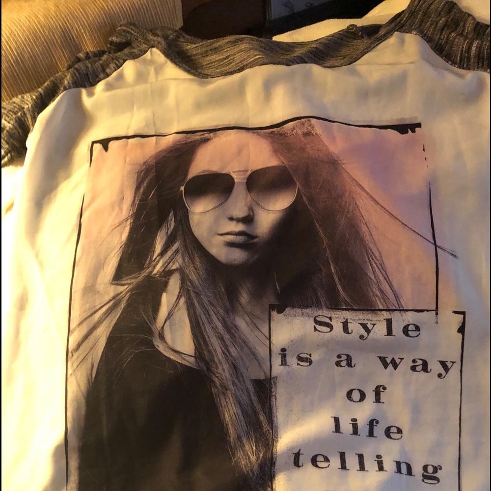 Light thin 3/4 sleeved t-shirt. Very cute